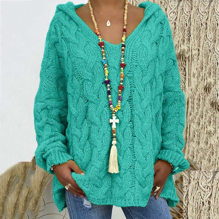 Women’s oversized hooded sweater with cable knit pattern, deep V-neck and side slits Mune Fashion