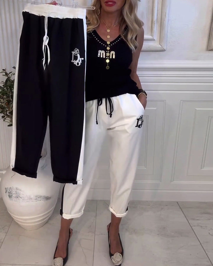 Women's cropped comfort joggers with side contrast stripes, elastic drawstring waist, and logo embroidery Mune Fashion
