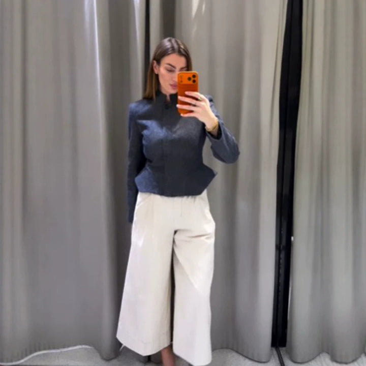 Women's short blazer with stand-up collar, fitted peplum, and concealed button placket Mune Fashion