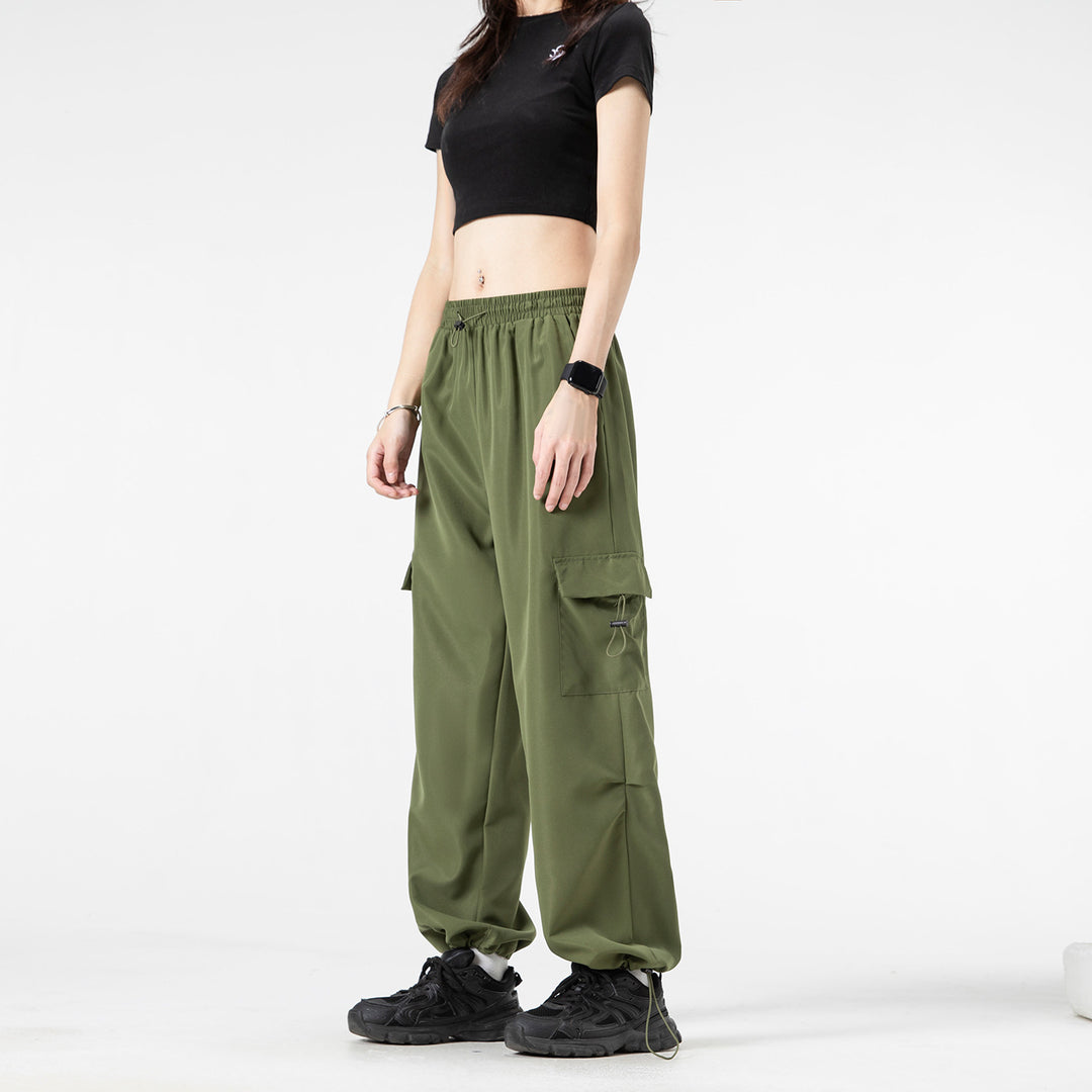 Men's wide technical cargo pants with drawstring waistband, multiple pockets and corded closure Drune