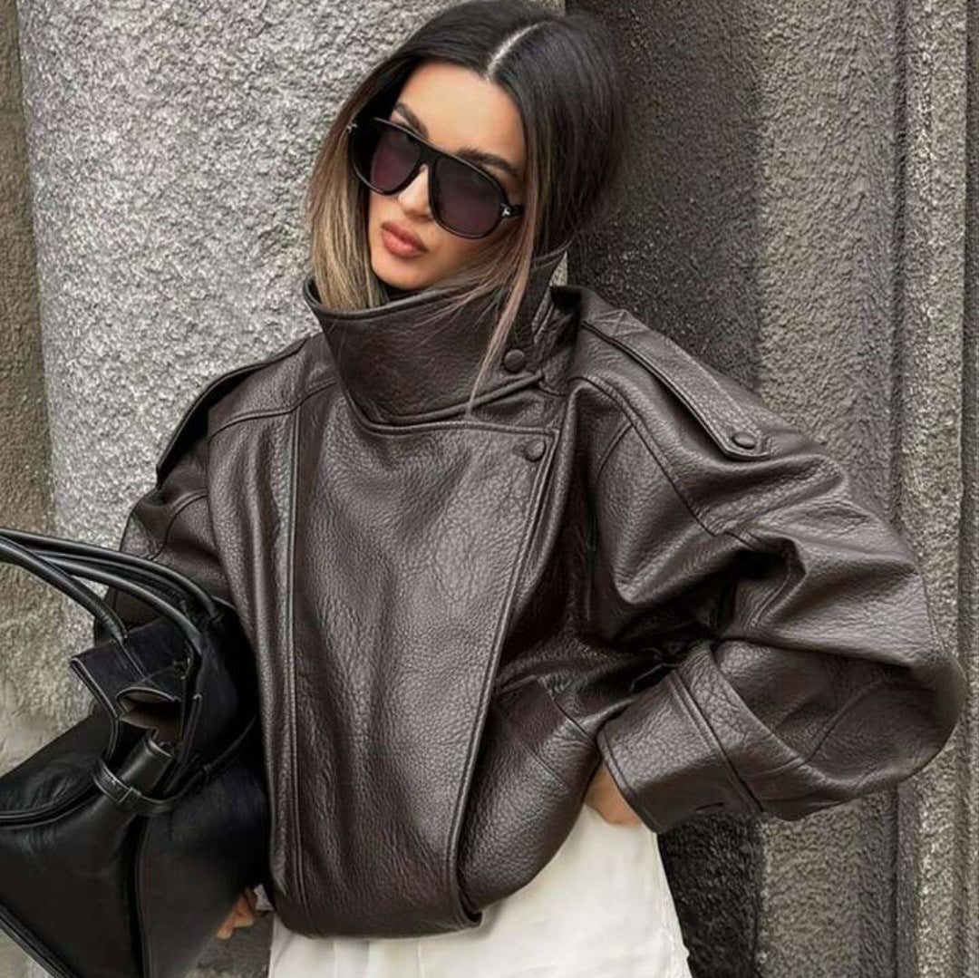 Ladies oversized biker jacket faux leather look with high stand-up collar, asymmetrical snap button front, shoulder straps and elastic hem Mune Fashion