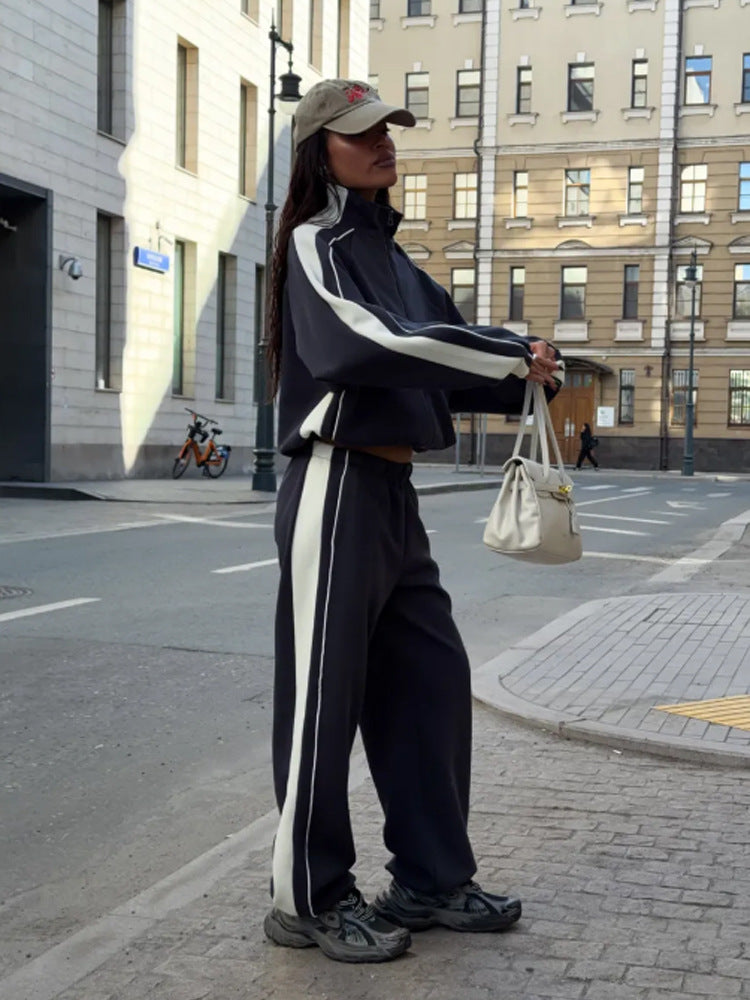 Women's oversized tracksuit with zip jacket, wide joggers, and contrast side stripes Mune Fashion