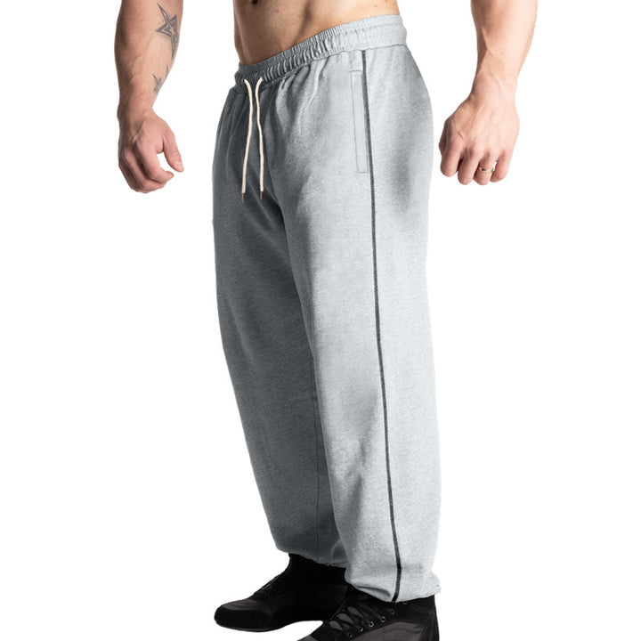 Men's casual jogging pants with elastic drawstring waistband, subtle side stripe, and deep side pockets Mune Fashion