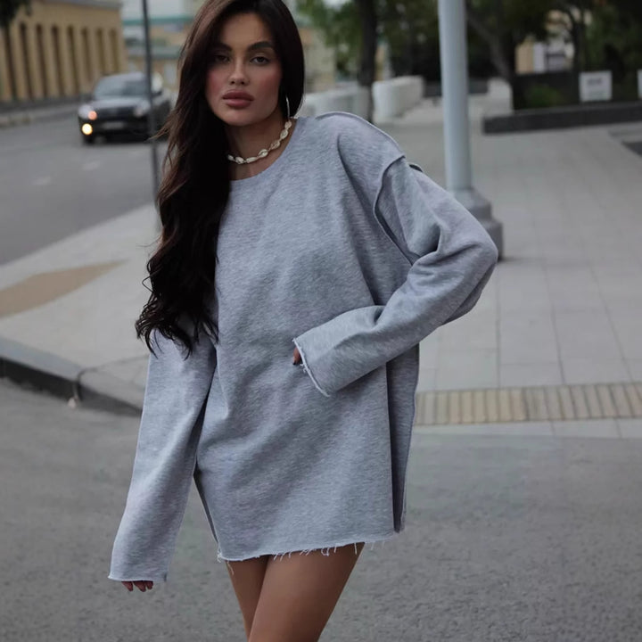 Women's oversized sweatshirt with frayed hem and extended sleeves Mune Fashion