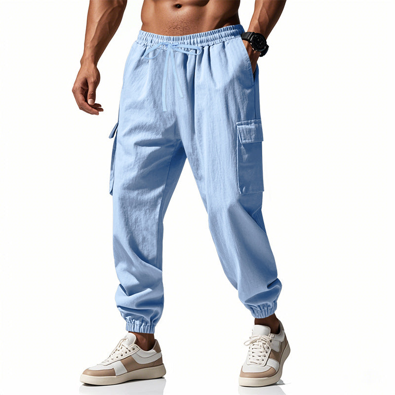 Men's tapered joggers in utilitarian style with elastic waistband, drawstring, and flap pockets Mune Fashion