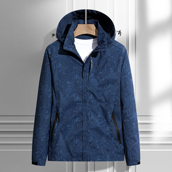 Women's lightweight packable rain and wind jacket with hood, leaf pattern and concealed zippers Mune Fashion
