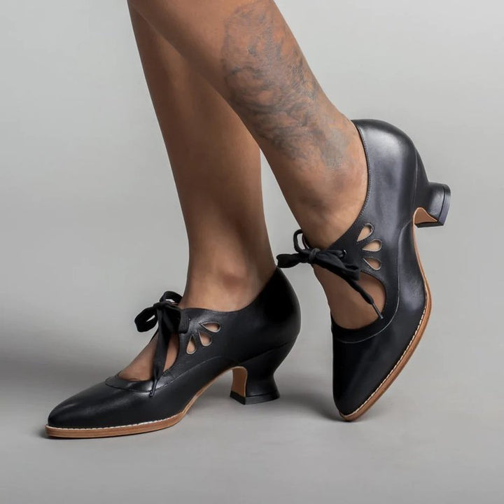Ladies nan retro strap pumps with curved kitten heel, leaf-shaped cutouts, and decorative bow closure Mune Fashion