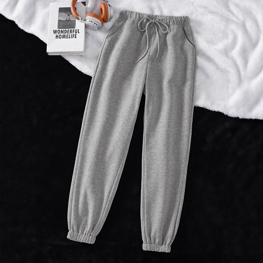 Women's high-cut joggers made of soft fleece cotton blend with elastic waistband, drawstring, and side pockets Mune Fashion