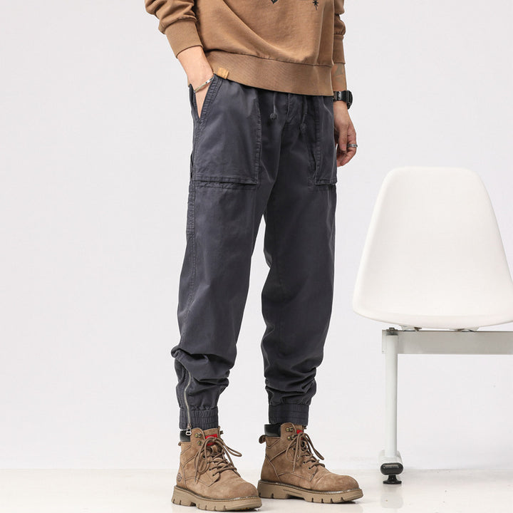 Men's workwear cargo pants in tech jogger style with applied front pockets, hammer loop, and ankle zippers Drune