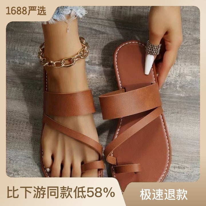 Women's flat faux leather thong sandal with crisscross straps and padded comfort footbed Mune Fashion