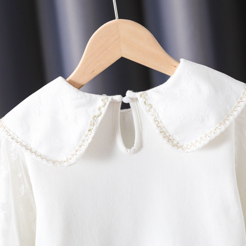 Women's blouse with decorative floral appliqués and transparent puff sleeves Mune Fashion