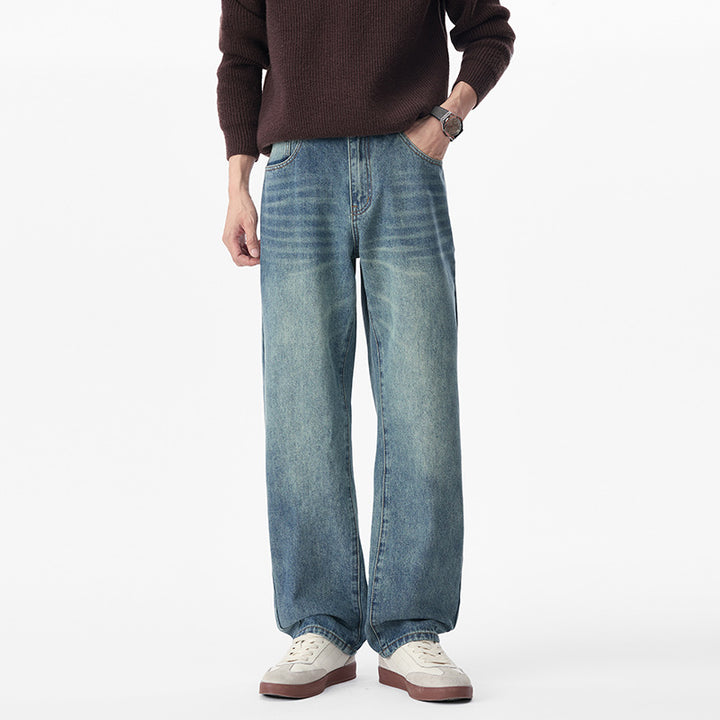 Men's baggy jeans made of heavy denim with a light used finish and a low crotch.