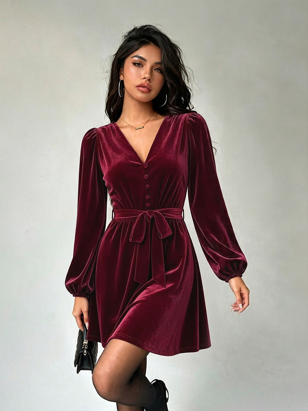 Women's elegant velvet mini dress with V-neck, button placket, balloon sleeves, and waist belt.