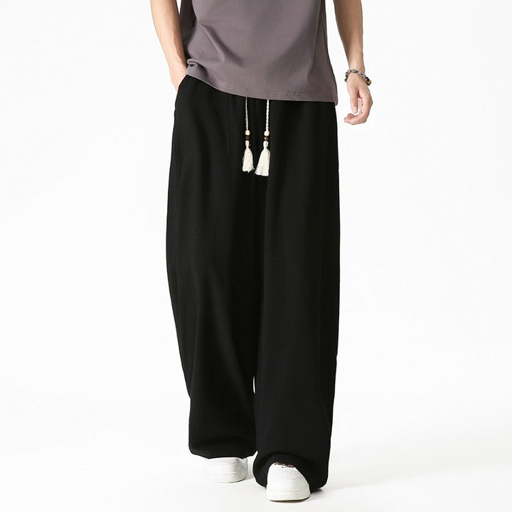 Men's loose-fitting lounge pants with tassel cord, elastic waistband, and patch pockets Mune Fashion