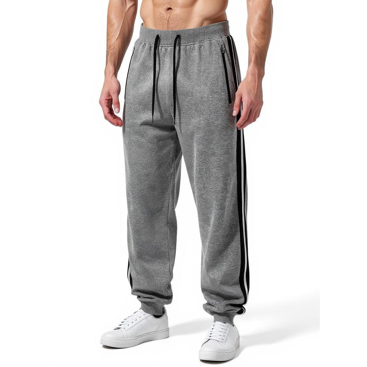 Men's sporty jogging pants with elastic waistband and side zip pockets Mune Fashion