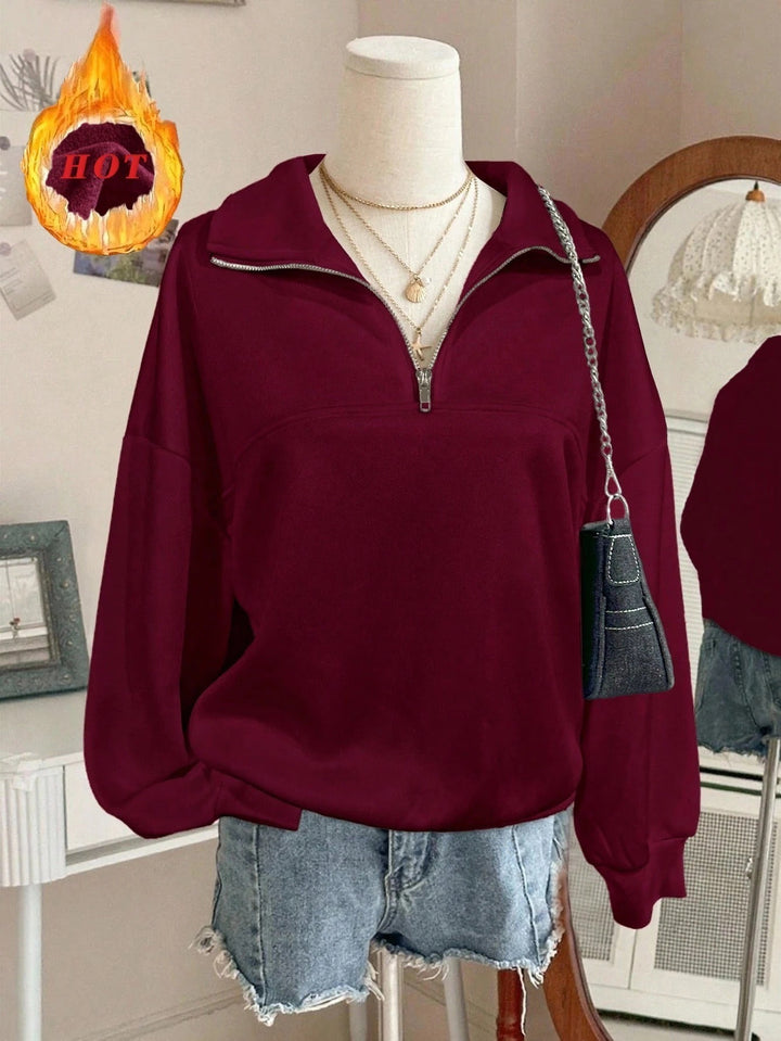 Women's oversized sweatshirt with half zipper, high collar and balloon sleeves Mune Fashion