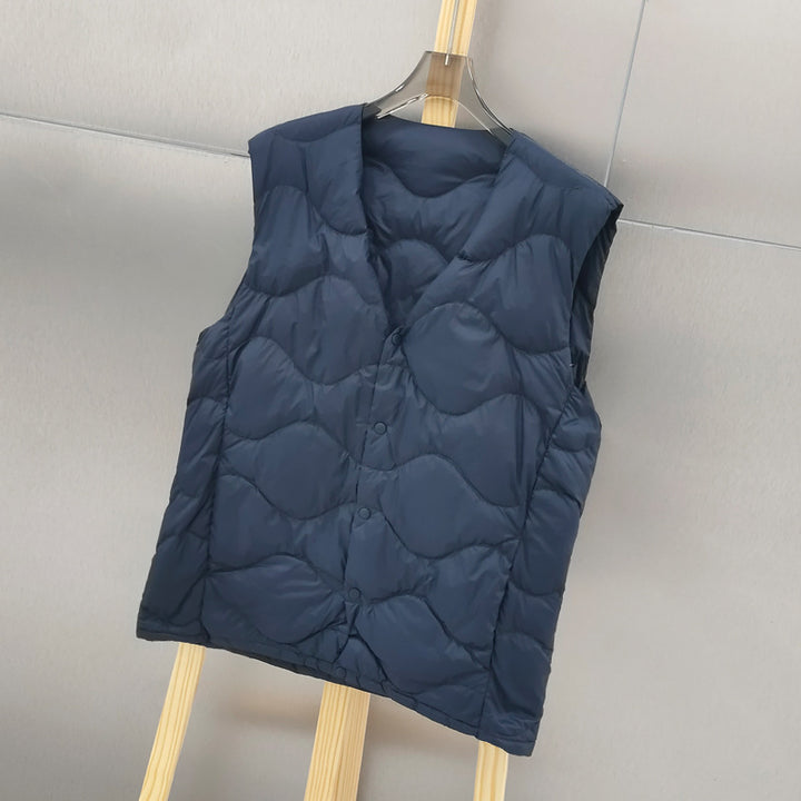 Women’s sleeveless thermal quilted vest with wave-shaped quilting and snap button closure Mune Fashion
