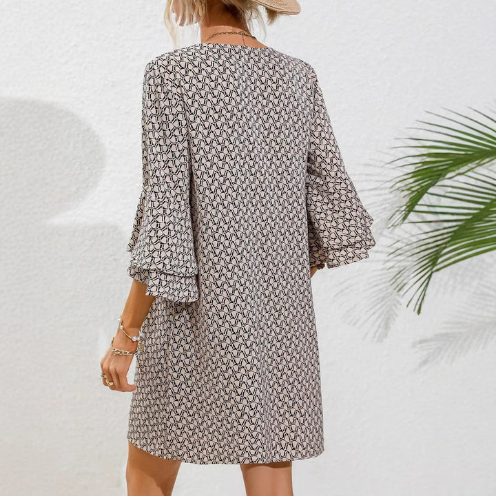 Women's flowing tunic mini dress with V-neck graphic chain pattern and double-layered bell sleeves Mune Fashion