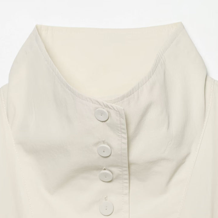 Women's cropped jacket with high stand-up collar, full button placket, and balloon sleeves Drune