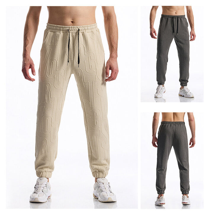 Men's jogging pants with elastic waistband, drawstring, and embossed all-over logo relief Mune Fashion