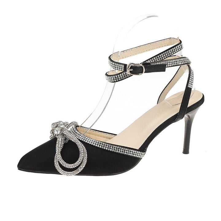 Women's pointed strap pumps with sparkling rhinestone bow appliqué and adjustable ankle strap Mune Fashion