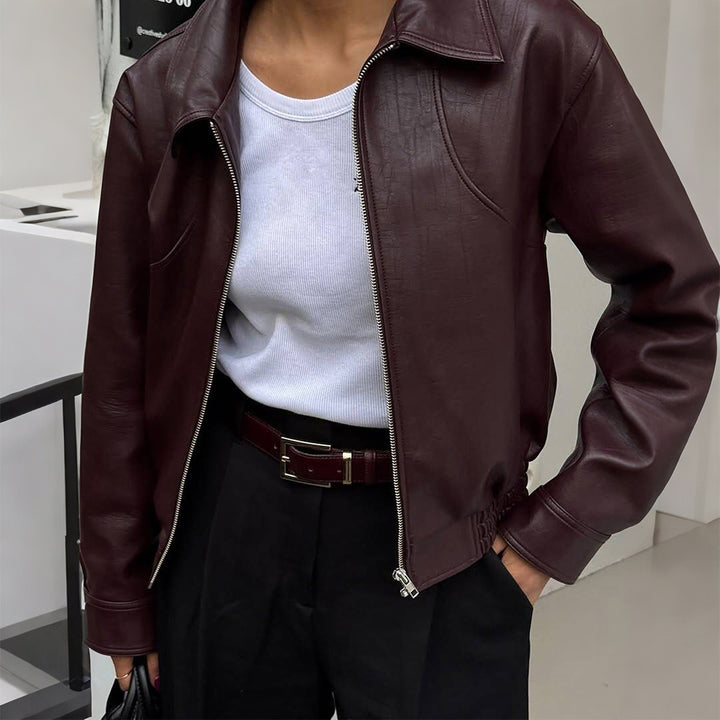Women's short oversized leather jacket with shirt collar, visible zipper, and casual silhouette Mune Fashion