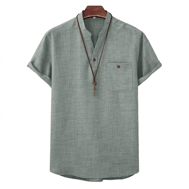 Men's casual Mandarin-style short-sleeve shirt with half-button placket, patch chest pocket, and rounded hem Mune Fashion