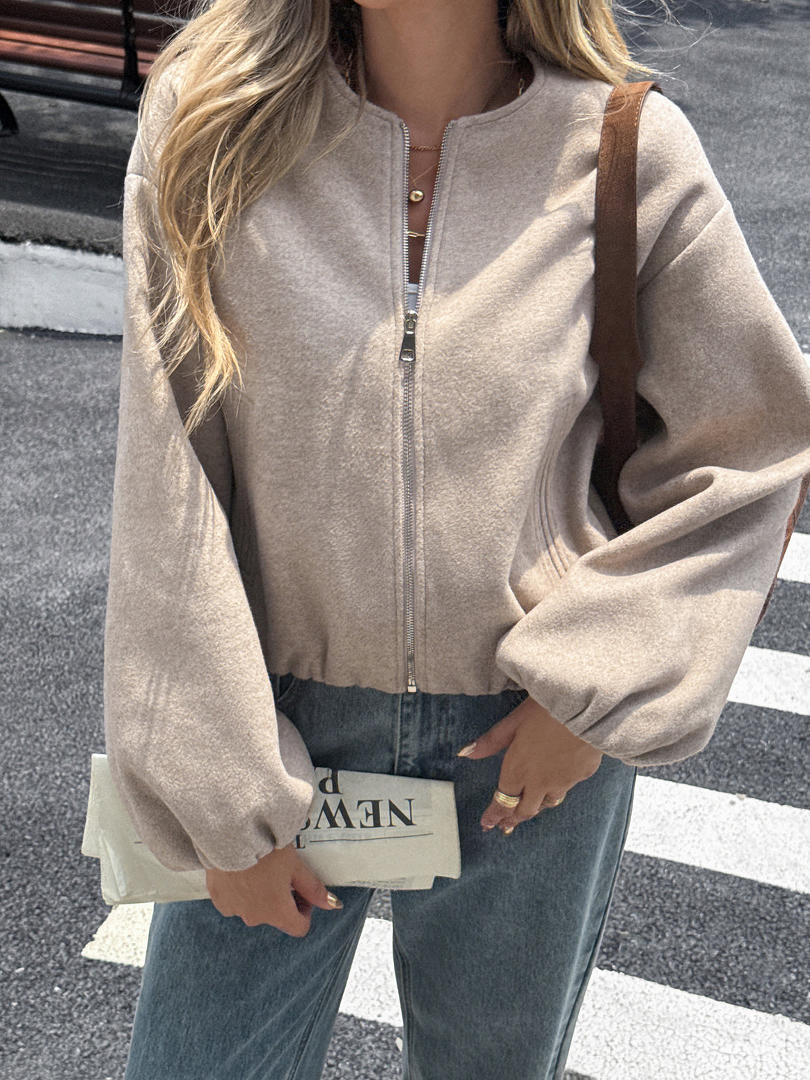 Women's short cozy bomber jacket with continuous zipper, elastic hem, and concealed pockets Mune Fashion