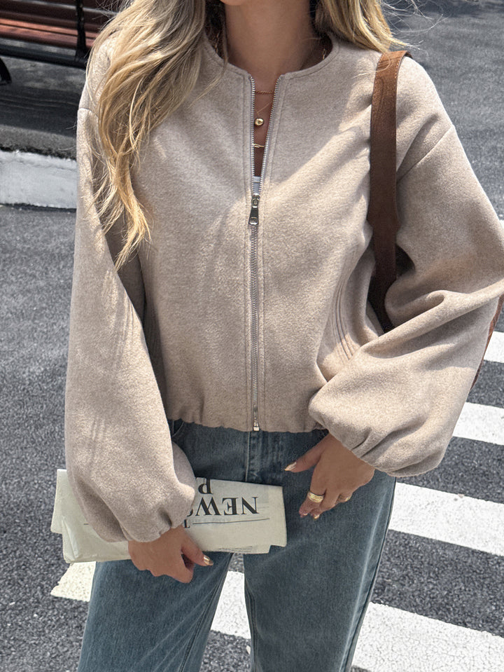 Women's short cozy bomber jacket with continuous zipper, elastic hem, and concealed pockets Mune Fashion