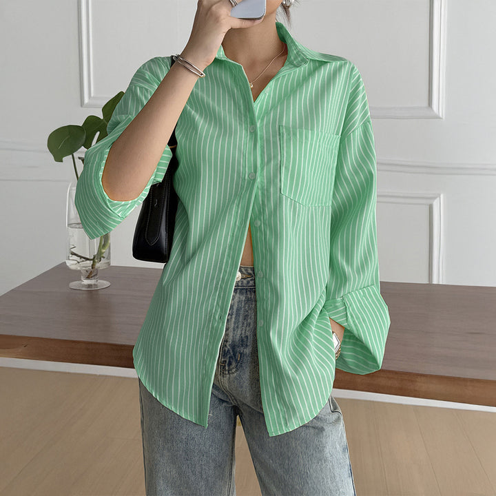 Women's oversized shirt blouse with boxy cut, breast pocket, and rounded hem Mune Fashion