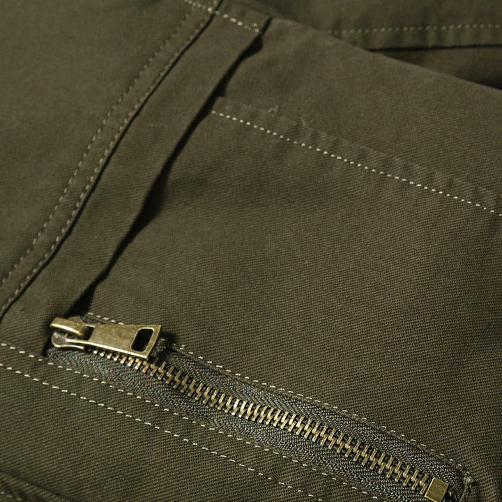 Men's canvas bomber jacket with checked lining, stand collar and badge appliqués Mune Fashion