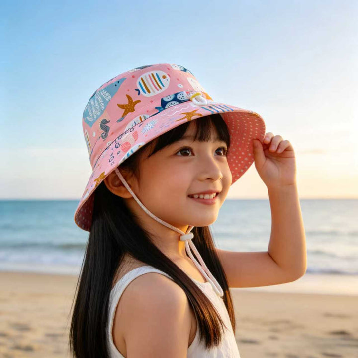 Unisex children's sun hat with reversible design, chin strap, and high UV protection Mune Fashion
