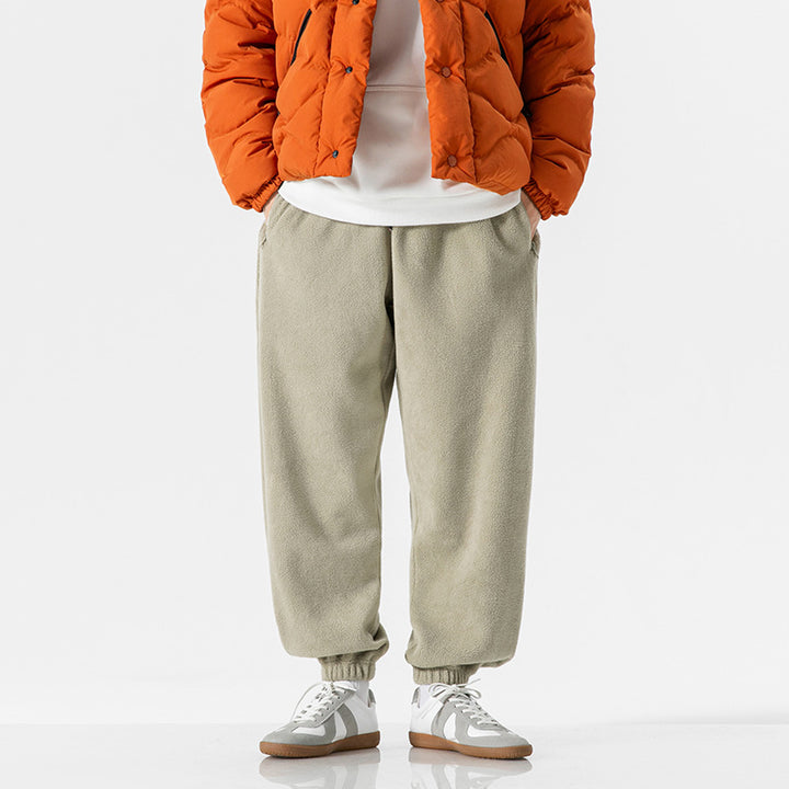 Men's wide-cut fleece jogging pants with elastic cuffs and side pockets Mune Fashion