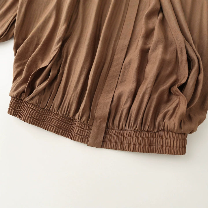 Women’s lightweight blouson jacket with pleated front, stand-up collar, and elastic hem Mune Fashion