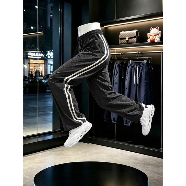 Women's sporty leisure pants with high waistband and side stripes Mune Fashion
