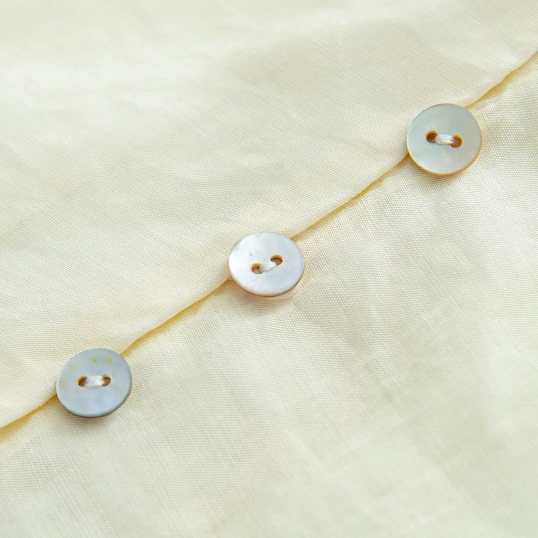 Women's delicate long sleeve blouse with tie ribbon at the neck and fine button placket Mune Fashion