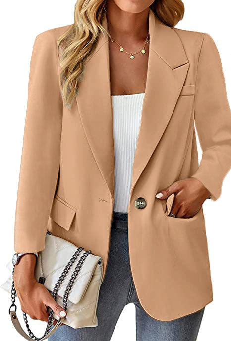 Ladies longline blazer in oversized style with a striking lapel, metal button, and patch pockets Mune Fashion