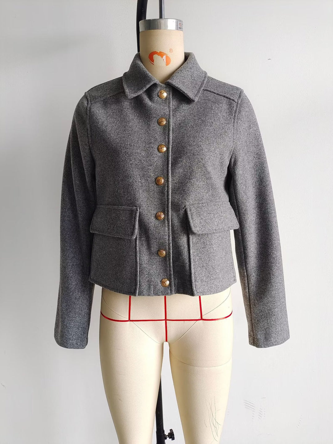 Women's short tailored wool jacket with decorative buttons and flap pockets Mune Fashion