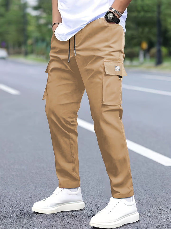 Men's tapered cargo pants in jogger style with drawstring, flap pockets & D-ring Mune Fashion