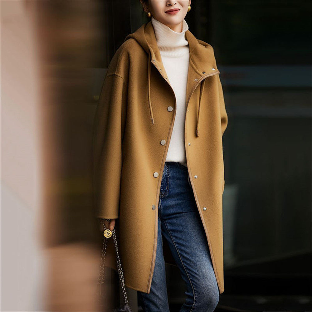 Women's mid-length wool blend coat with hood and snap button placket in oversized fit Mune Fashion
