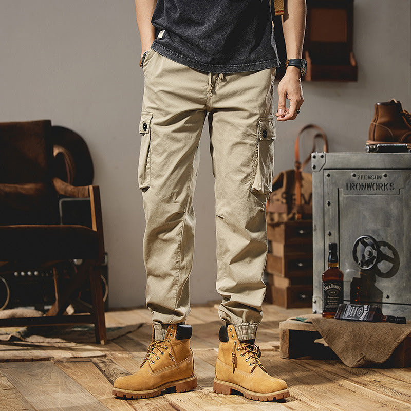 Men's robustly constructed cargo pants in jogger style with drawstring waistband, flap pockets, and elastic ankle cuffs Mune Fashion