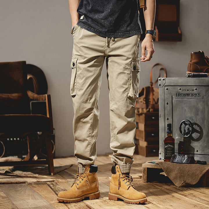 Men's robustly constructed cargo pants in jogger style with drawstring waistband, flap pockets, and elastic ankle cuffs Mune Fashion