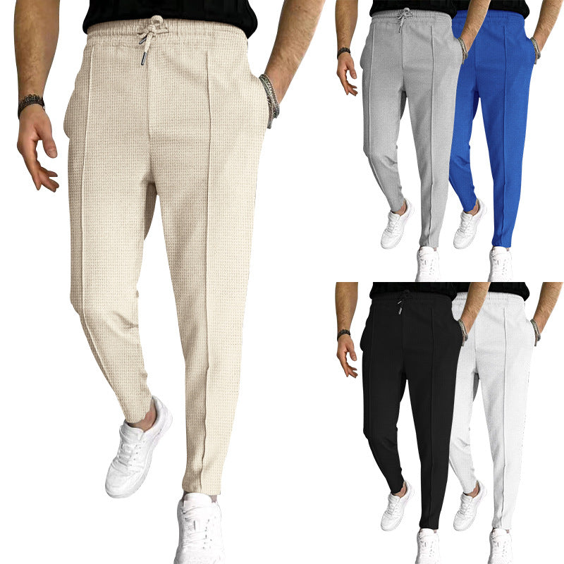 Men's patterned jogging pants with elastic drawstring, shaping crease, and tapered leg Mune Fashion