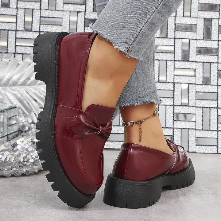 Women’s shiny platform loafers with oversized bow appliqué and profiled rubber sole Mune Fashion