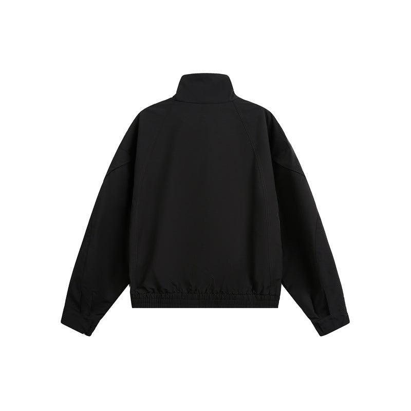 Unisex short jacket in minimalist tech fabric with funnel collar and concealed front placket Mune Fashion