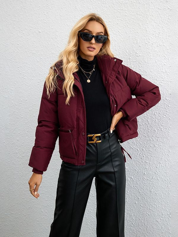 Women's short quilted down-look quilted jacket with high stand-up collar, drawstring, and zip pockets Mune Fashion