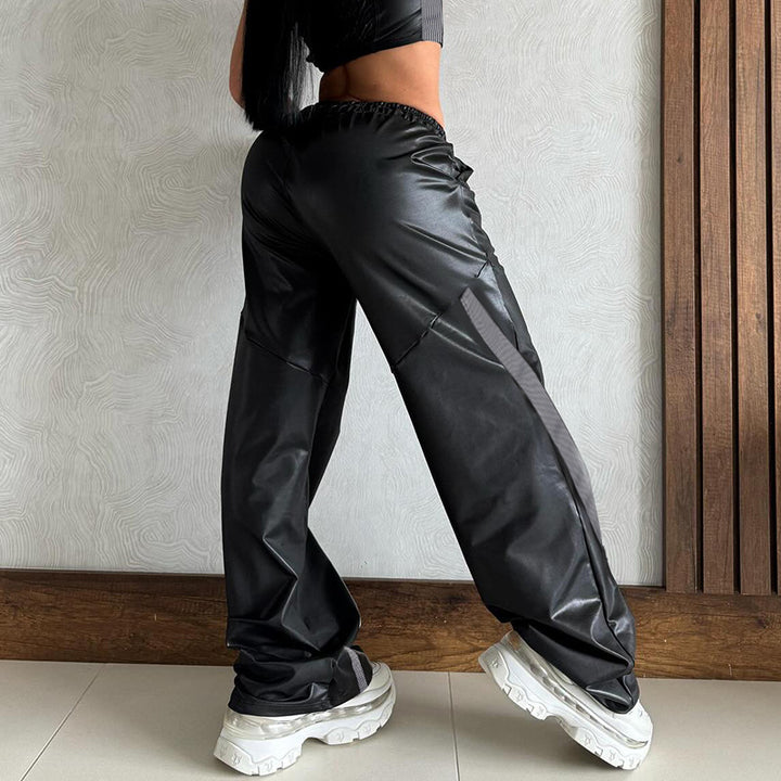 Ladies wide faux leather track pants with elastic waistband, drawstring and side stripes Mune Fashion