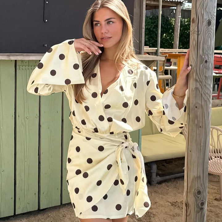 Ladies wrap mini dress with V-neck, bell sleeves and polka dot print Mune Fashion