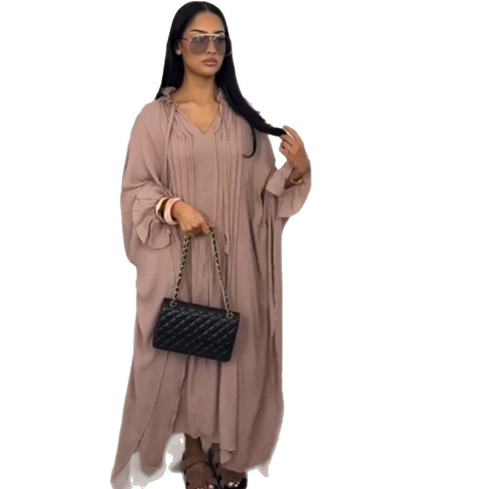 Women's maxi dress in kaftan style with ruffled collar, tie straps, and voluminous sleeves Mune Fashion