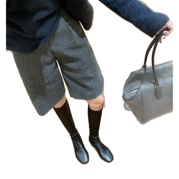 Women’s leather knee-high boots with a slim silhouette and flat heel Mune Fashion
